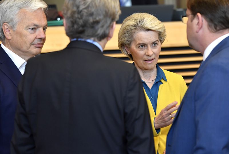 File - European Commission President Ursula von der Leyen, second right, speaks with from left, European Commissioner for Justice Didier Reynders, European Commissioner for Internal Market Thierry Breton and European Commissioner for Neighborhood and Enlargement Oliver Varhelyi during a meeting of the College of Commissioners at EU headquarters in Brussels, Friday, June 17, 2022. (AP Photo/Geert Vanden Wijngaert, File)