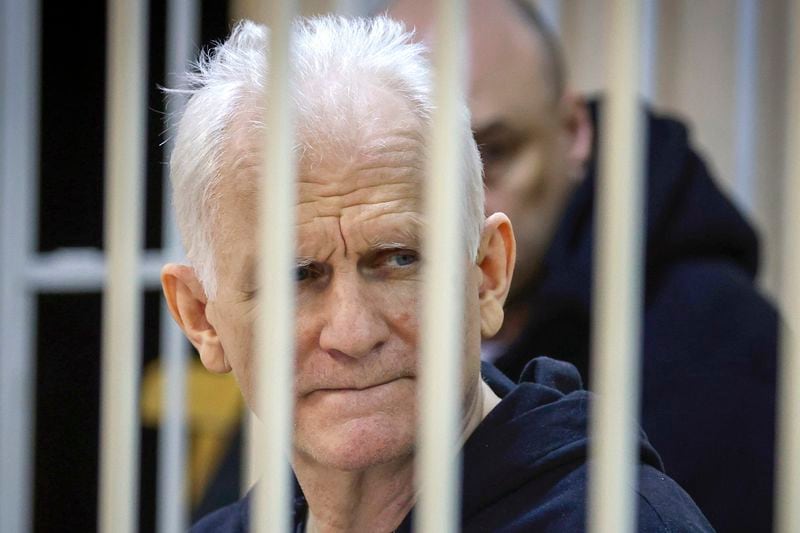 FILE - Ales Bialiatski, the head of the Viasna human rights group, sits in a defendants' cage at a court session in Minsk, Belarus, on Jan. 5, 2023. (Vitaly Pivovarchyk/BelTA Pool Photo via AP, File)