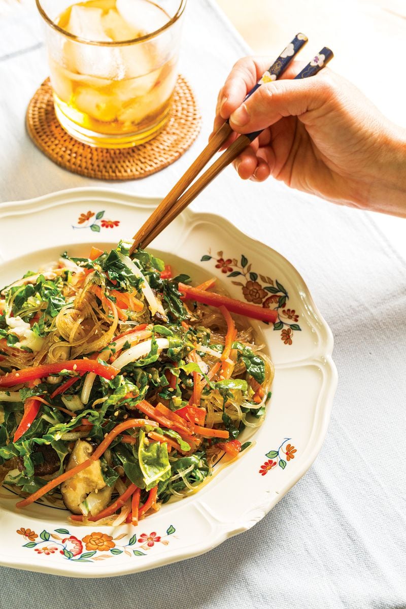 Natalie Keng, author of “Egg Rolls & Sweet Tea: Asian Inspired, Southern Style” (Gibbs Smith, $32), uses mung bean noodles in her Japchae-Inspired Glass Noodles with Swiss Chard. (Courtesy of Deborah Whitlaw Llewellyn)