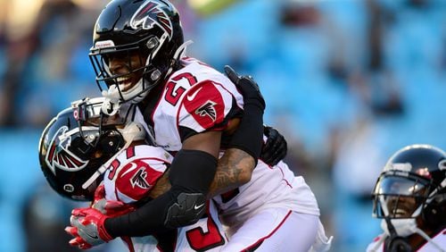 Falcons safeties Damontae Kazee (27) and Ricardo Allen celebrate after the team's fourth interception against the Carolina Panthers Sunday, Nov. 17, 2019, at Bank of America Stadium in Charlotte. Atlanta won 26-9.