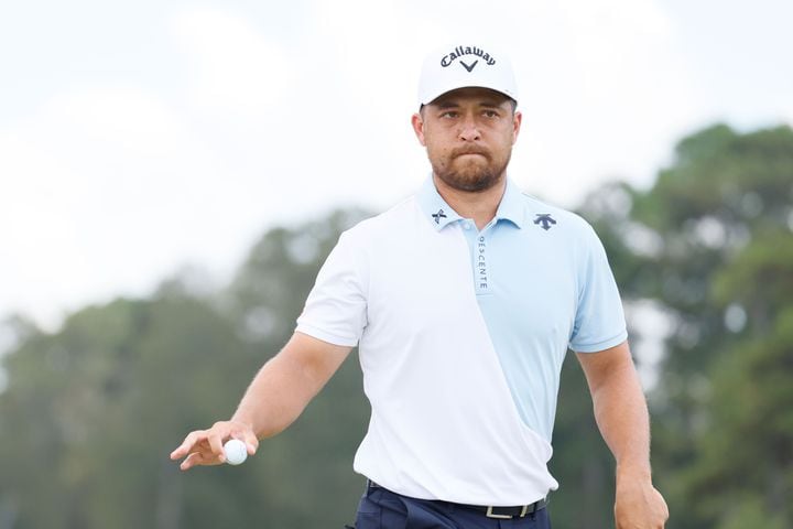 Xander Schauffele reacts after putting on the sixth green during the final round of the Tour Championship at East Lake Golf Club, Sunday, Sept. 1, 2024, in Atlanta.
(Miguel Martinez / AJC)