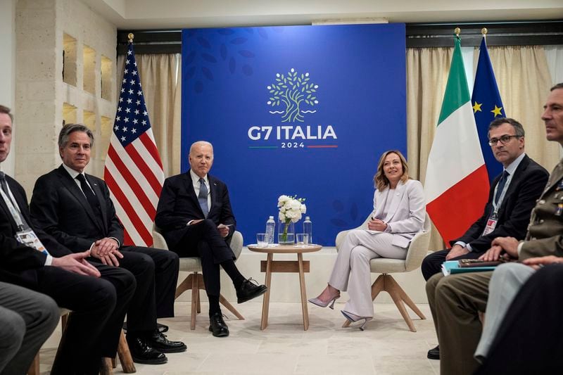 U.S. President Joe Biden and Italian Prime Minister Giorgia Meloni, center right, meet for bilateral talks at the G7, Friday, June 14, 2024, in Borgo Egnazia, near Bari, southern Italy. (AP Photo/Alex Brandon)