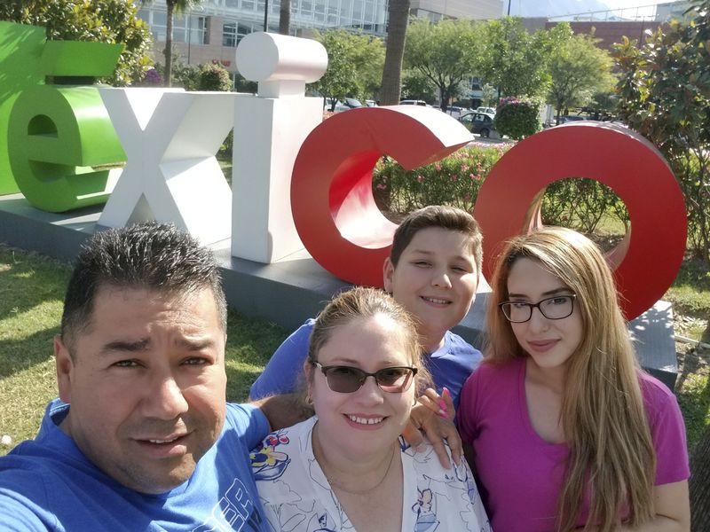 This photo provided by Juan Enrique Sauceda, shows Sauceda, left, with his wife Nancy Valderrama Riveros, second left, and their children Brayan Alexander Sauceda, and Jennifer Janneth Sauceda, in Monterey, Mexico, June 8, 2019. (Courtesy Juan Enrique Sauceda via AP)