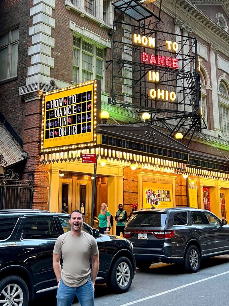 Greg Kamp stands under the “How to Dance in Ohio” Broadway marquee. Photo: Courtesy of Greg Kamp