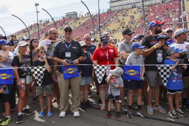 Fans wait for drivers to enter their cars before a NASCAR Cup Series auto race, Sunday, Sept. 15, 2024, in Watkins Glen, N.Y. (AP Photo/Lauren Petracca)