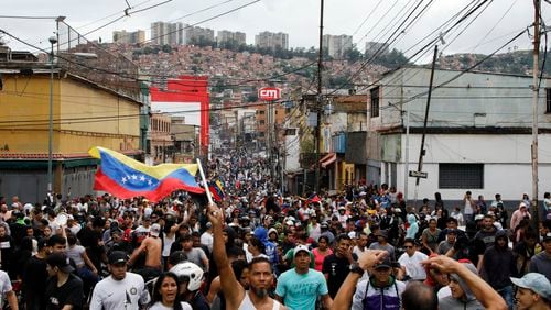 FILE - Protesters demonstrate against the official election results declaring President Nicolas Maduro won reelection in the Catia neighborhood of Caracas, Venezuela, July 29, 2024, the day after the vote. (AP Photo/Cristian Hernandez, File)