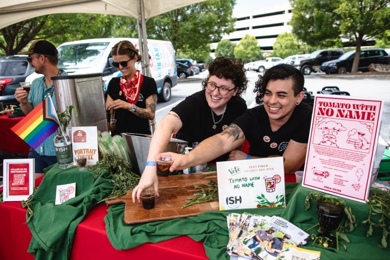 The Finca to Filter team passes out samples of a tomato leaf and coffee mocktail during the 2023 Attack of the Killer Tomato Festival.