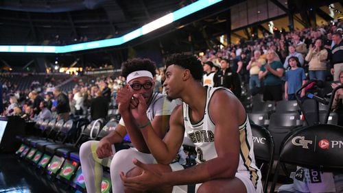Georgia Tech guard Shembari Phillips (right) and center James Banks sit on the bench prior to the Yellow Jackets' game against Pittsburgh March 5, 2020 at McCamish Pavilion. (Danny Karnick/Georgia Tech Athletics)