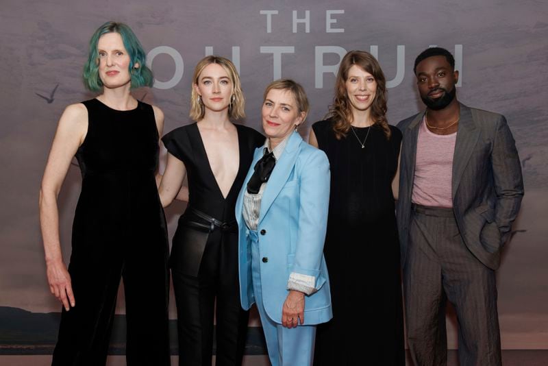 Amy Liptrot, Saoirse Ronan, Saskia Reeves, Nora Fingscheidt and Paapa Essiedu pose for photographers upon arrival for the screening of the film 'The Outburn' on Wednesday, Sept. 18, 2024 in London. (Photo by Vianney Le Caer/Invision/AP)