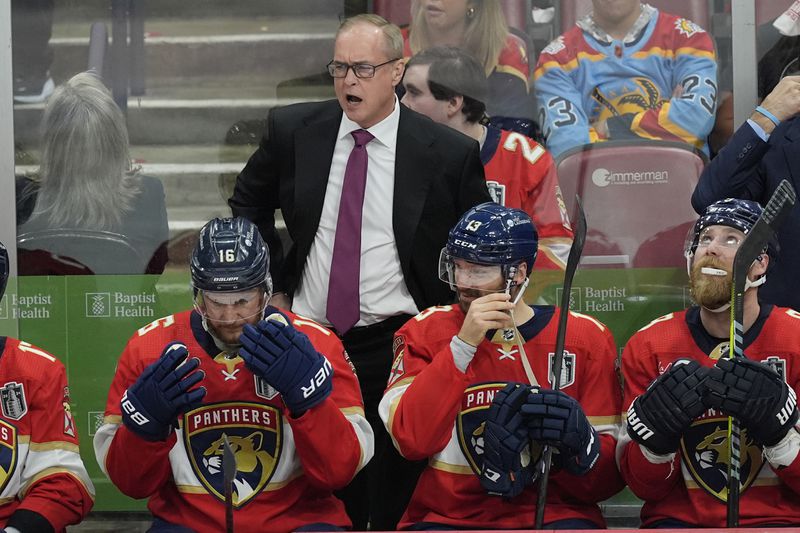 Florida Panthers head coach Paul Maurice gestures during the second period of Game 5 of the NHL hockey Stanley Cup Finals against the Edmonton Oilers, Tuesday, June 18, 2024, in Sunrise, Fla. (AP Photo/Rebecca Blackwell)
