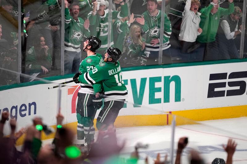 Dallas Stars left wing Mason Marchment, left, and Ty Dellandrea (10) celebrate after Marchment scored against the Edmonton Oilers during the third period in Game 2 of the Western Conference finals in the NHL hockey Stanley Cup playoffs Saturday, May 25, 2024, in Dallas. (AP Photo/Tony Gutierrez)