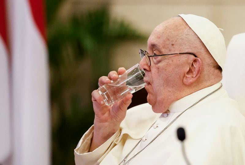 Pope Francis drinks water as he attends a meeting with Indonesian authorities, civil society and the diplomatic corps, during his apostolic visit to Asia, at the Presidential Palace in Jakarta Wednesday, Sept. 4, 2024. (Willy Kurniawan/Pool Photo via AP)