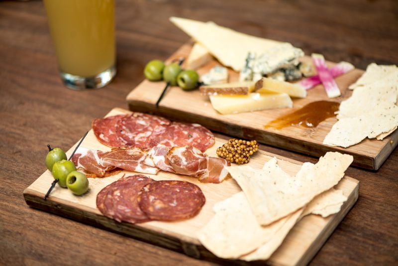 Sceptre Brewing Arts Meat and Cheese Boards with a Built on Ashes on draft.