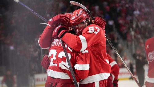 FILE - Detroit Red Wings left wing Lucas Raymond (23) celebrates with Moritz Seider (53) after his goal against the Montreal Canadiens in overtime during an NHL hockey game Monday, April 15, 2024, in Detroit. (AP Photo/Paul Sancya, File)