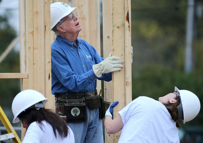 November 2, 2015 Memphis: Former President Jimmy Carter helps position an exterior wall while working on a Habitat for Humanity build Monday morning November 2, 2015 in Memphis. Ben Gray / bgray@ajc.com