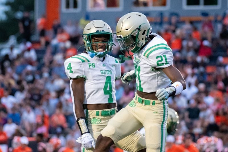 Buford players celebrate after a touchdown during the Buford at North Cobb football game Friday night, September 1, 2023. Buford defeated North Cobb 45-28, and retained the No. 1-ranking in Class 7A. (Jamie Spaar for the Atlanta Journal Constitution)