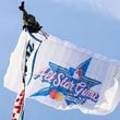 A parachute flies approaching Truist Park during the unveiling celebrations of the 2025 All-Star Game logo on Monday, July 22, 2024, in Atlanta.

(Miguel Martinez/ AJC)