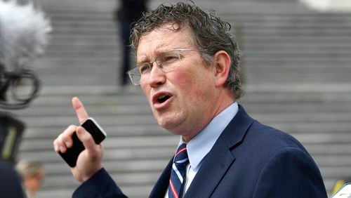 FILE - In this March 27, 2020 file photo Rep. Thomas Massie, R-Ky., talks to reporters before leaving Capitol Hill in Washington. Massie, a Kentucky congressman said Kyle Rittenhouse charged with fatally shooting two people with a semi-automatic rifle during the unrest in Wisconsin showed “incredible restraint" and acted in self-defense. (AP Photo/Susan Walsh, File)