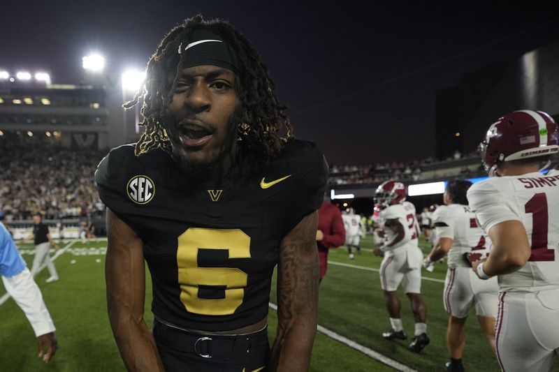 Vanderbilt cornerback Kolbey Taylor (6) celebrates the team's win against Alabama after an NCAA college football game Saturday, Oct. 5, 2024, in Nashville, Tenn. (AP Photo/George Walker IV)