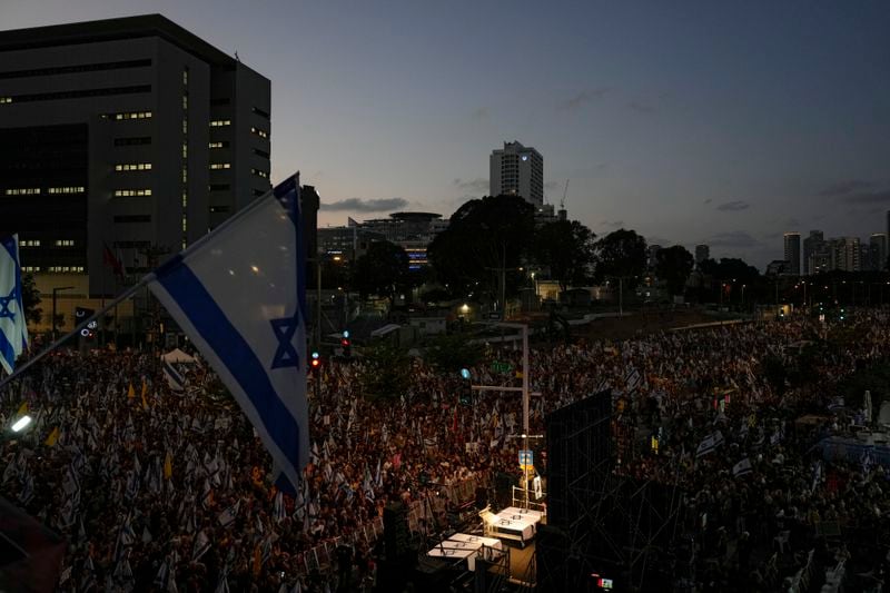 People take part in a protest calling for a deal for immediate release of hostages held in the Gaza Strip by the Hamas militant group, in Tel Aviv, Israel, Sunday, Sept. 1, 2024. (AP Photo/Ariel Schalit)