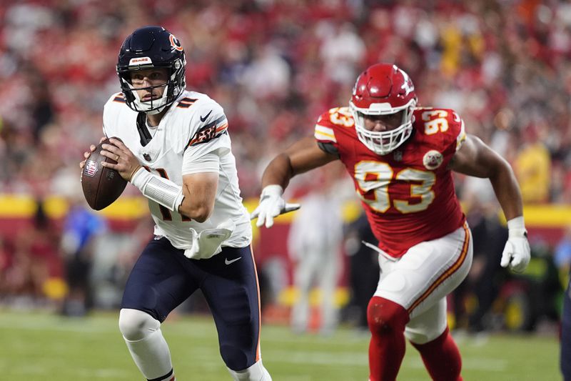 Chicago Bears quarterback Brett Rypien (11) scrambles as Kansas City Chiefs defensive tackle Matt Dickerson (93) defends during the first half of an NFL preseason football game Thursday, Aug. 22, 2024, in Kansas City, Mo. (AP Photo/Charlie Riedel)