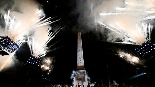 Artists perform with fireworks during the Paris 2024 Paralympic Opening Ceremony at the Place de la Concorde in Paris, France, Wednesday, Aug. 28, 2024. (Julien De Rosa/Pool Photo via AP)