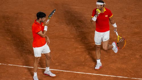 Carlos Alcaraz and Rafael Nadal of Spain compete against Austin Krajicek Rajeev Ram of the USA during the men's doubles quarter-final tennis competition at the Roland Garros stadium, at the 2024 Summer Olympics, Wednesday, July 31, 2024, in Paris, France. (AP Photo/Manu Fernandez)