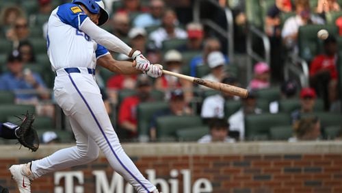 Atlanta Braves first baseman Matt Olson (28) hits a solo home run during the fifth inning at Truist Park on Saturday, June 15, 2024 in Atlanta. Atlanta Braves won 9-2 over Tampa Bay Rays. (Hyosub Shin / AJC)