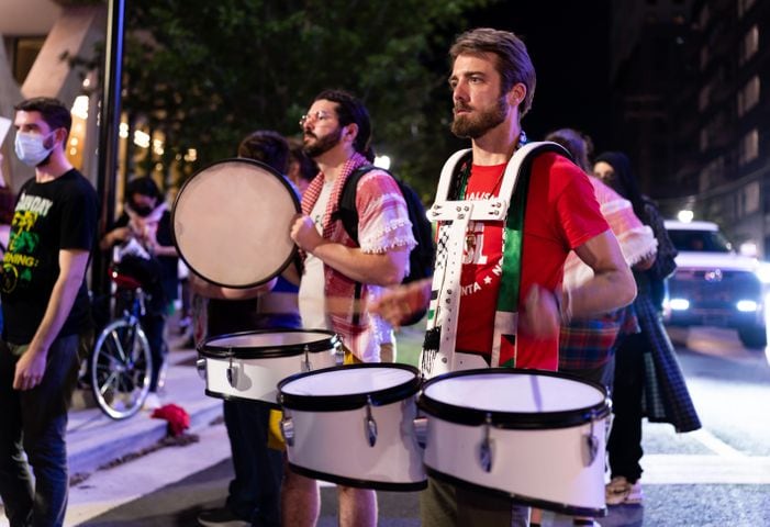 Brandon Beachum of the Party for Socialism and Liberation plays the drums at a pro-Palestine protest near the intersection of 10th Street NW and Spring Street NW in Atlanta on Thursday, June 27, 2024. Nearby, President Joe Biden and former President Donald Trump participated in a debate hosted by CNN. (Seeger Gray / AJC)