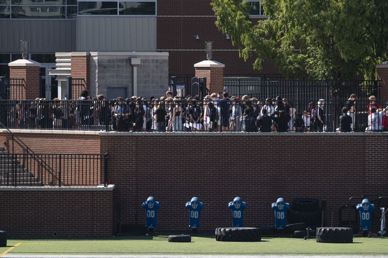 Students at Decatur High School stage a short walkout against gun violence on Friday, Sept. 20, 2024.   Ben Gray for the Atlanta Journal-Constitution