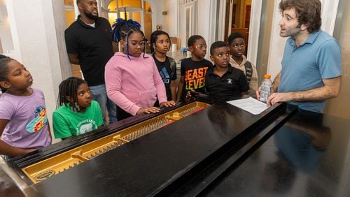 Jazz musician Joe Alterman (far right) answers questions about the piano at a summer camp at Callanwolde Fine Arts Center. PHIL SKINNER FOR THE ATLANTA JOURNAL-CONSTITUTION