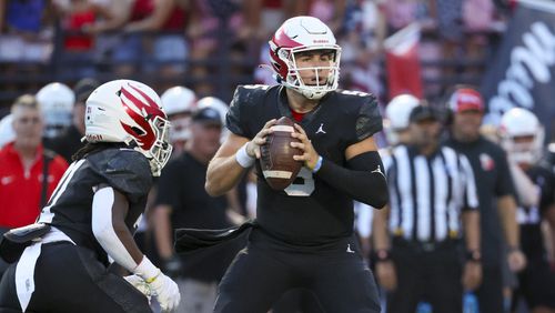 Milton quarterback Luke Nickel (5) attempts a pass during the first half against Buford at Milton High School, Friday, August 16, 2024, in Milton, Ga. (Jason Getz / AJC)
