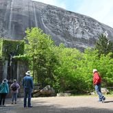 April 20, 2021 Stone Mountain - Park goers walk around Valor Park were Statue of Valor is located at Stone Mountain Park on Tuesday, April 20, 2021. (Hyosub Shin / Hyosub.Shin@ajc.com)