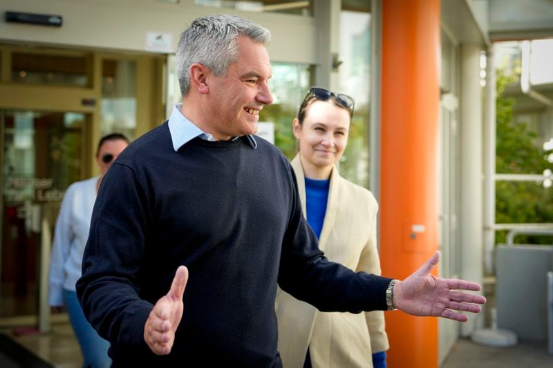 Austrian Chancellor Karl Nehammer smiles while leaving a polling station in Vienna, Austria, Sunday, Sept. 29, 2024, after casting his vote in the country's national election. (AP Photo/Andreea Alexandru)