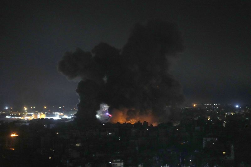 Flames and smoke rise from Israeli airstrikes in Dahiyeh, Beirut, Lebanon, Friday, Oct. 4, 2024. (AP Photo/Hussein Malla)