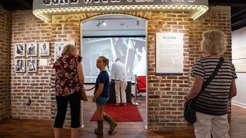 Attendees preview an updated exhibit on “Gone With the Wind” at the Margaret Mitchell House in Atlanta on Tuesday, July 9, 2024. (Seeger Gray / AJC)