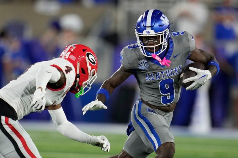 Kentucky wide receiver Ja'Mori Maclin (9) is tackled by Georgia defensive back KJ Bolden (4) during the first half of an NCAA college football game, Saturday, Sept. 14, 2024, in Lexington, Ky. (AP Photo/Darron Cummings)