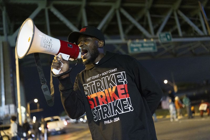 Third generation longshoreman Ray Bailey Jr. trustee of ILA Local 1291 encourages picketers outside the Packer Avenue Marine Terminal Port, Tuesday, Oct. 1, 2024.(AP Photo/Ryan Collerd)