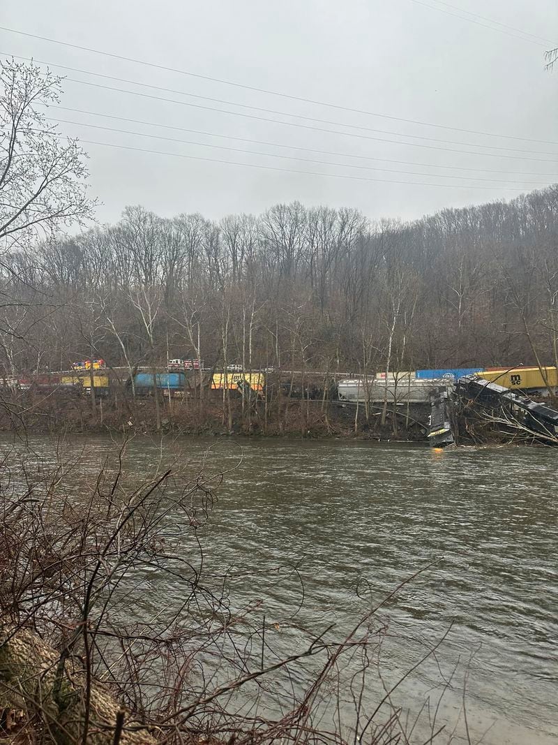 This photo provided by Nancy Run Fire Company shows a train derailment along a riverbank in Saucon Township, Pa., on Saturday, March 2, 2024.   Authorities said it was unclear how many cars were involved but no injuries or hazardous materials were reported.   (Nancy Run Fire Company via AP)