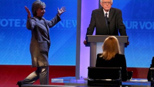 MANCHESTER, NH - DECEMBER 19: Democratic president candidate Bernie Sanders waits as Hillary Clinton walks on stage at Saint Anselm College December 19, 2015 in Manchester, New Hampshire. This is the third Democratic debate featuring Democratic candidates Hillary Clinton, Bernie Sanders and Martin O'Malley. (Photo by Andrew Burton/Getty Images)