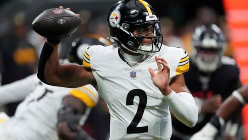 Pittsburgh Steelers quarterback Justin Fields looks to pass during the first half of an NFL football game against the Atlanta Falcons on Sunday, Sept. 8, 2024, in Atlanta. (AP Photo/John Bazemore)