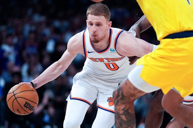 FILE - New York Knicks guard Donte DiVincenzo (0) dribbles during the second half of Game 7 in an NBA basketball second-round playoff series against the Indiana Pacers, on May 19, 2024, in New York. (AP Photo/Julia Nikhinson, File)