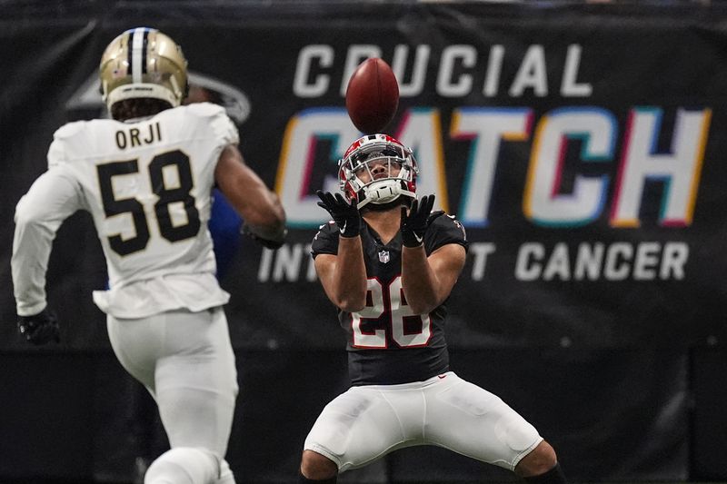 Atlanta Falcons running back Avery Williams (26) fields a punt against the New Orleans Saints during the first half of an NFL football game, Sunday, Sept. 29, 2024, in Atlanta. (AP Photo/John Bazemore)