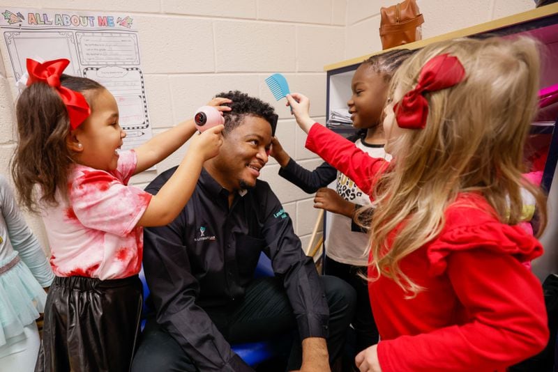 P-k students have fun with teacher Jonathon Hines during playtime at Barack Obama Elementary School on Tuesday, Feb 14, 2023. Miguel Martinez / miguel.martinezjimenez@ajc.com