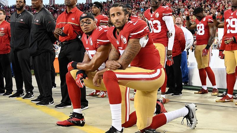Colin Kaepernick (right) and Eric Reid kneel in protest during the national anthem prior to a game Sept. 12, 2016, at Levi's Stadium in Santa Clara, Calif.