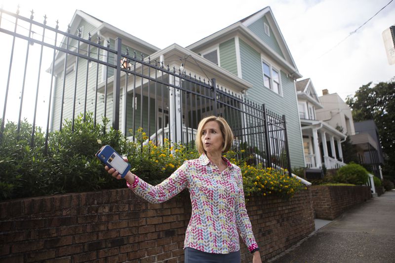 Jennifer Bentson, an Old Fourth Ward resident, stands in front of her house and discusses the impacts of a proposed Atlanta Streetcar extension. Bentson said she supports transit on the Beltline but opposes the proposed streetcar extension. CHRISTINA MATACOTTA FOR THE ATLANTA JOURNAL-CONSTITUTION.