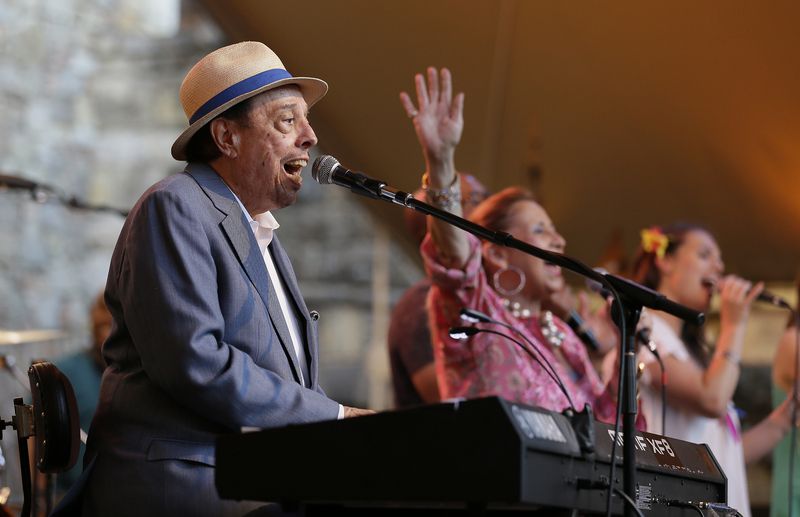 FILE - Sergio Mendes performs with his wife, Gracinha Leporace, center, at the Castello di Amorosa in Calistoga, Calif., on Wednesday, July 20, 2016, as part of the Festival Napa Valley. (AP Photo/Eric Risberg, File)