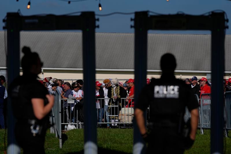 Supporters wait to go through security as they arrive before Republican presidential nominee former President Donald Trump speaks at a campaign rally at the Butler Farm Show, Saturday, Oct. 5, 2024, in Butler, Pa. (AP Photo/Julia Demaree Nikhinson)