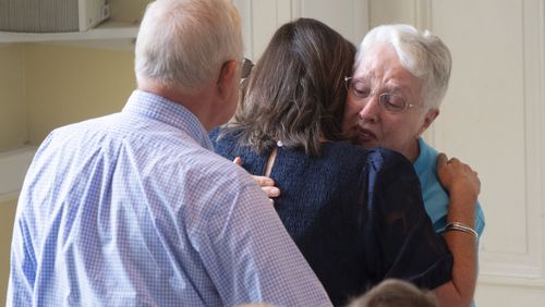 People comfort each other at the end of service at Winder First United Methodist Church in Winder on Sunday, Sept. 8, 2024, the first Sunday following the shootings at Apalachee High School.  Ben Gray for the Atlanta Journal-Constitution