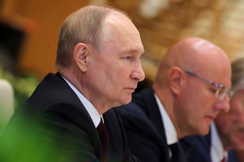 Russian President Vladimir Putin, left, listens to Vietnamese Prime Minister Pham Minh Chinh, not pictured, during a meeting at the government office in Hanoi, Vietnam Thursday, June 20, 2024. (Luoung Thai Linh/Pool Photo via AP)